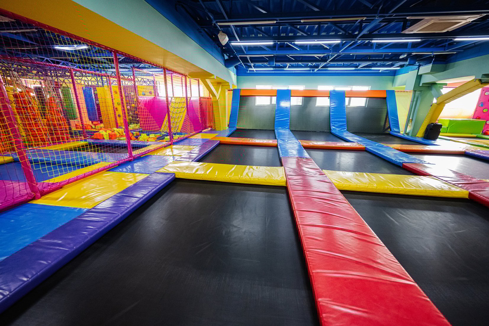 Set of trampolines at indoor play center playground.